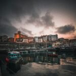 landscape photography of house and boat